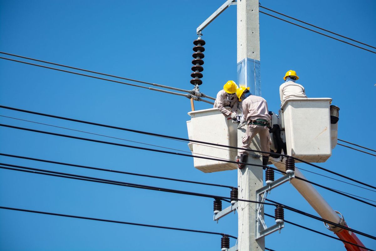 Electrician completing tenant improvement wiring in a Wildomar commercial space